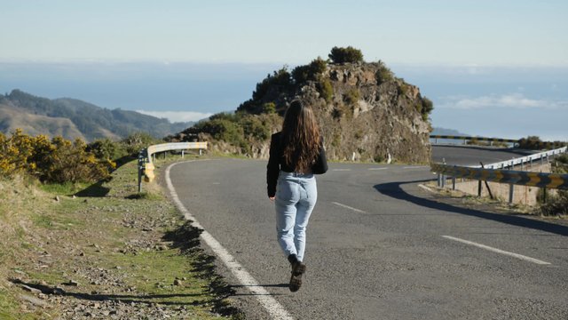 Walking along a road in the mountains