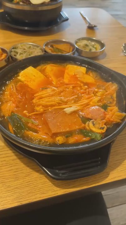 Seoul Sisters Pocha - Kimchi Jjigae - hot pot stew with mushroom, spam, sausage, tofu, ramen noodles and veggies - Korean Near Me - Rochester, New York