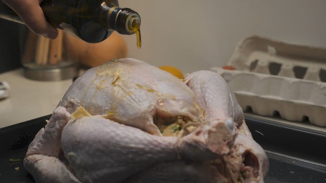 Pouring oil on a turkey