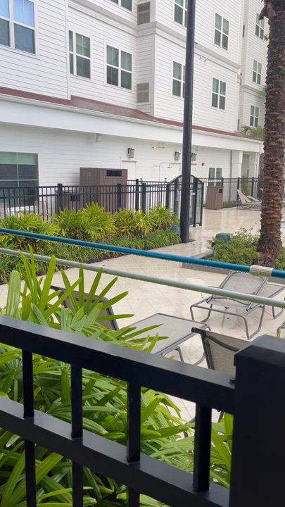 Residence Inn - Outside by the pool.  Rains from hurricane Debby. - Hotels Near Me - Winter Garden, Florida