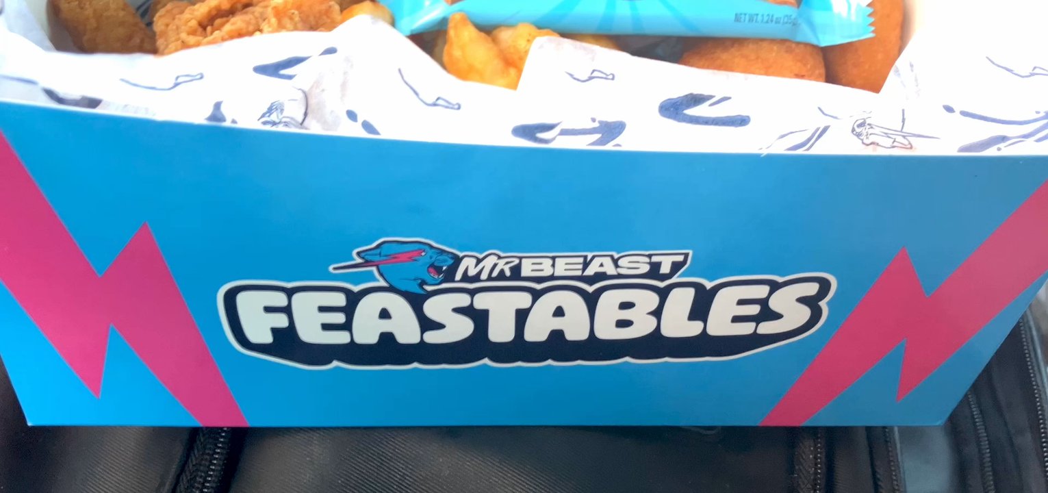 Zaxbys - MrBeast Box-chicken fingerz, fries, white cheddar bites, feastables milk chocolate bar, Texas toast, small coke, zax & spicy zax sauce - Fast Food Near Me - Keller, Texas