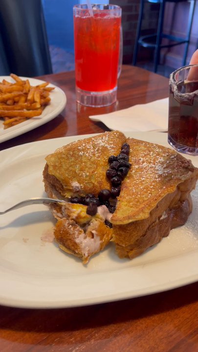 Blackboard Bistro - The best part is having this French Toast Royal for dessert--filled w/cream cheese & blueberries! I usually share it with someone! @ojbaylen - American Near Me - Seal Beach, California