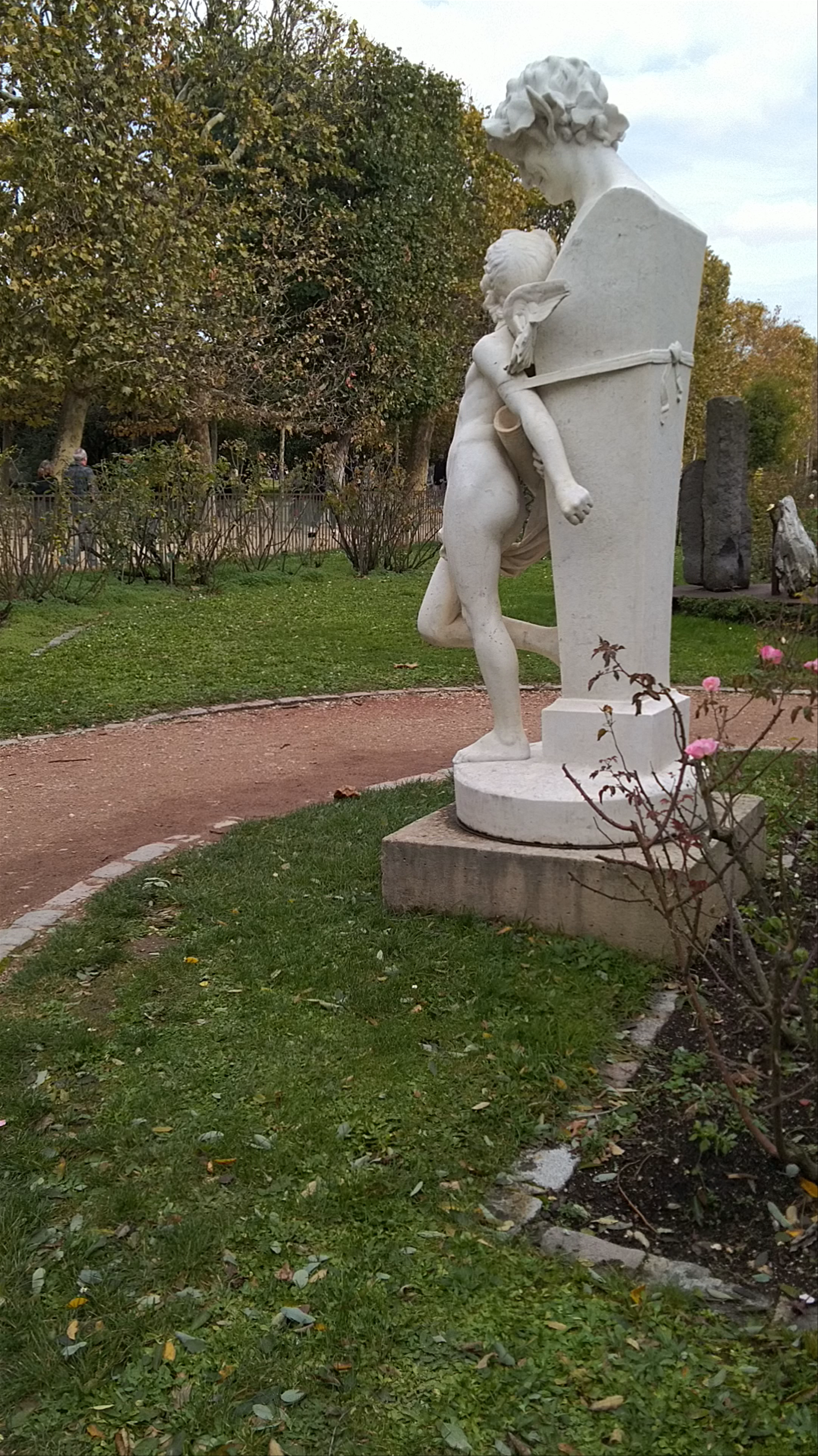 Tranquil Stroll Through Roseraie Garden in Paris