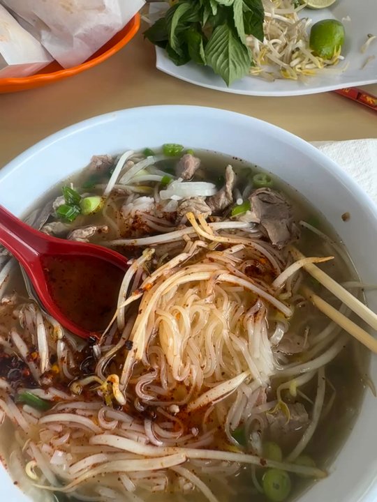 Hoang Tofu - The beef pho with some chili crisp. You don't need the chili!! The broth is perfect but I like a little heat. - Vietnamese Near Me - Nashville, Tennessee