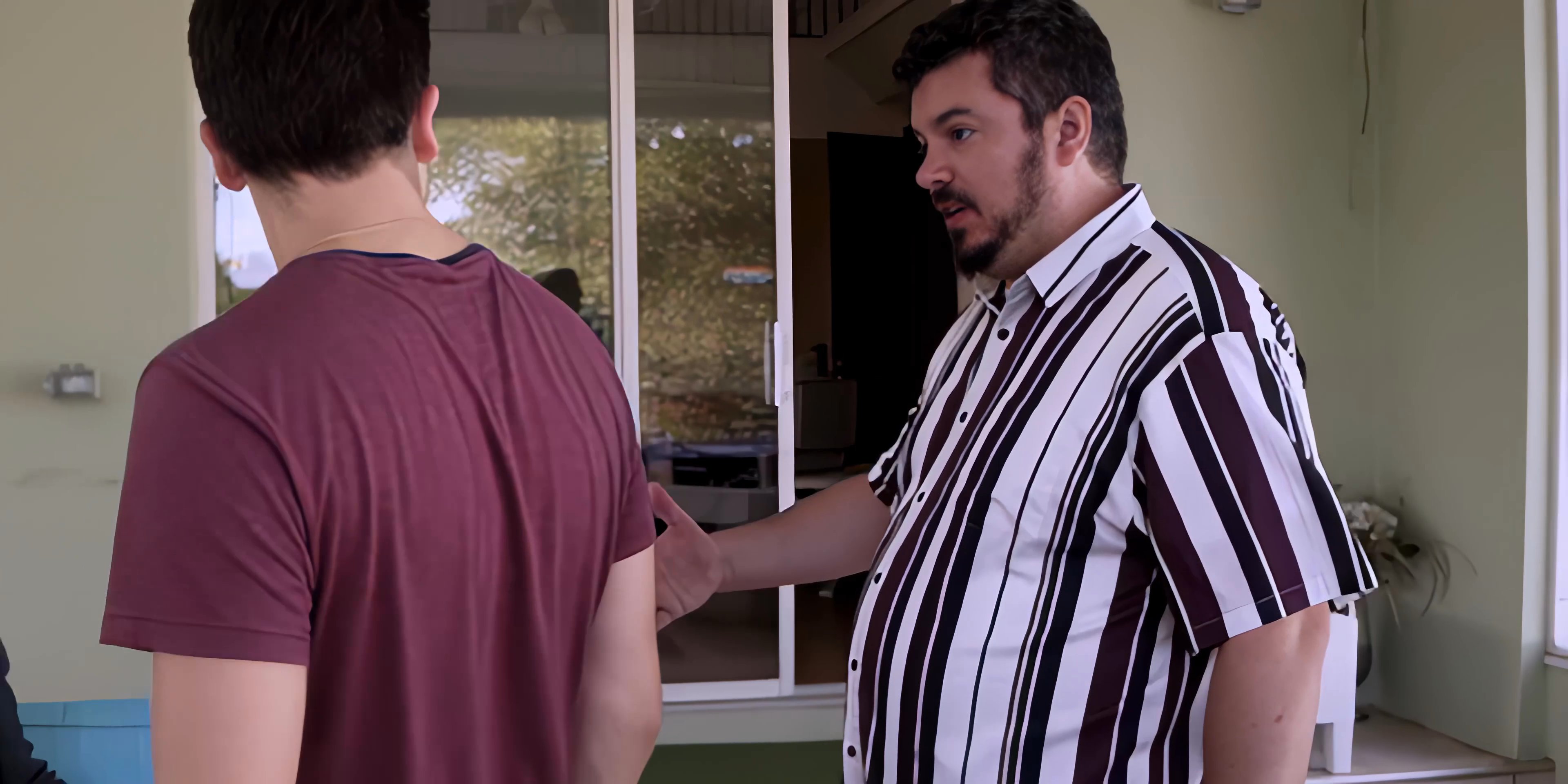 Business professionals engage in a formal discussion followed by a handshake to finalize an agreement on a patio. The interaction involves a multi-party dialogue reflecting a collaborative professional setting.