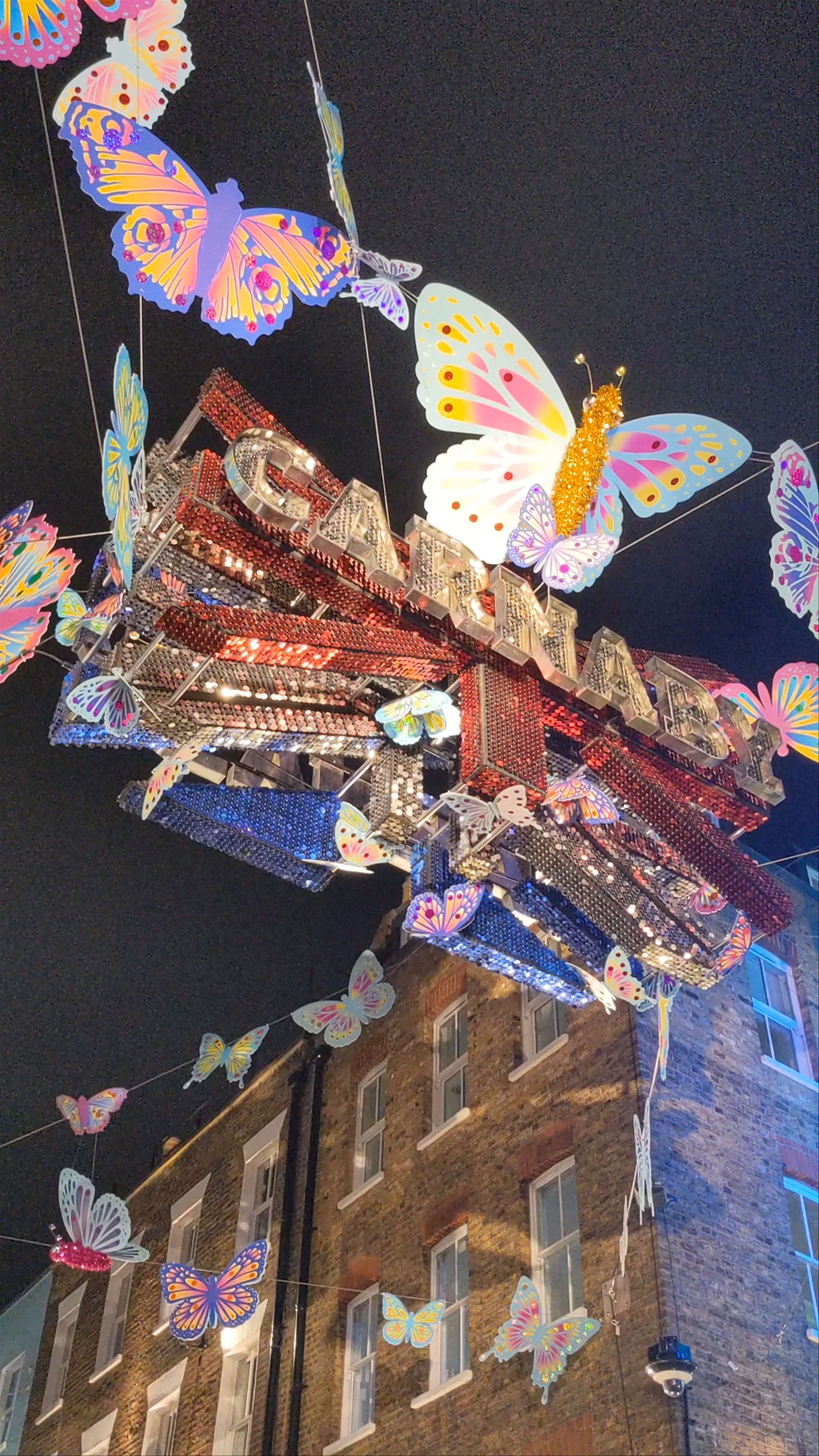 Carnaby Street Nightscape: Vibrant Butterfly Lights in London