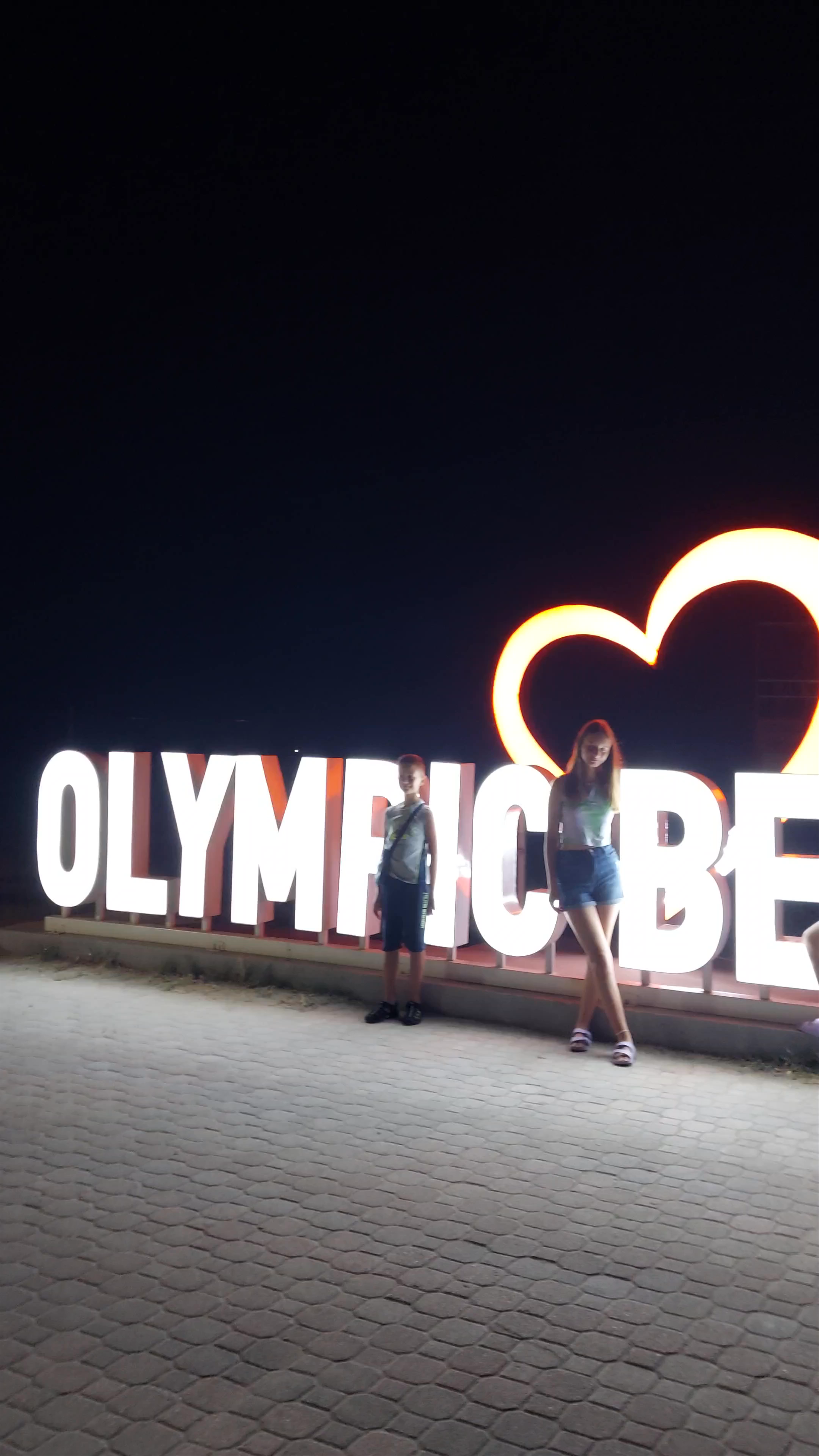 Heart of Olympic Beach at Night: Vibrant Evening Stroll