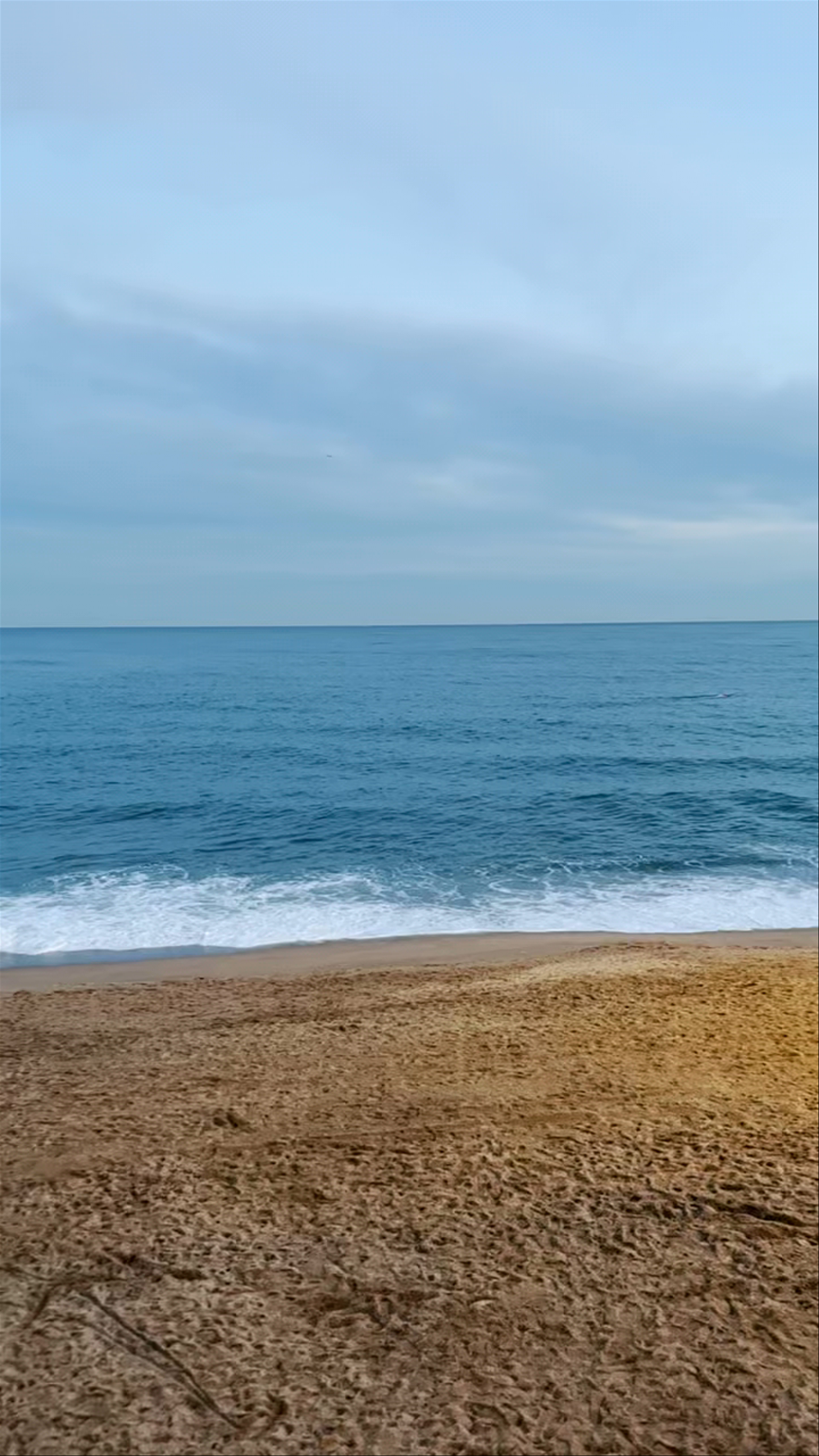 Sant Miquel Beach at Dusk: Serene Coastal Escape in Barcelona