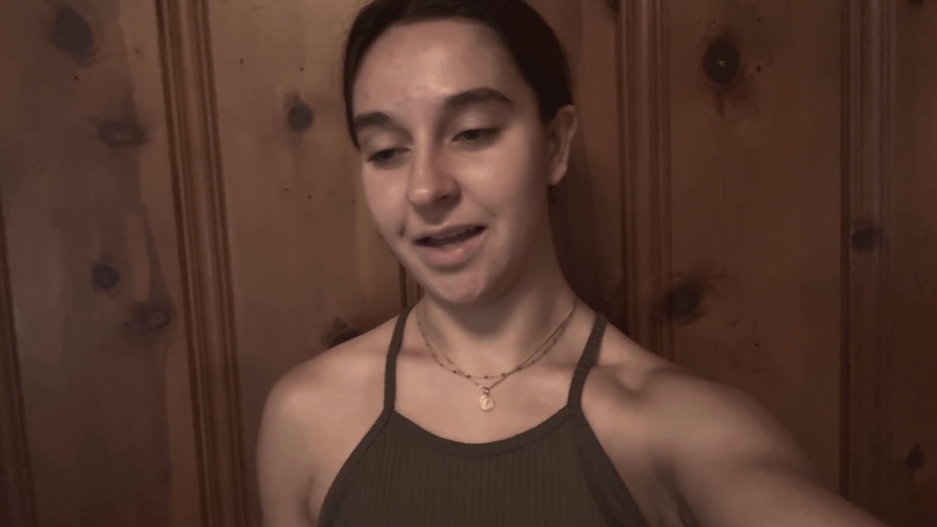 Two individuals perform a collaborative vocal piece in a split-screen format, alternating verses against contrasting backgrounds.