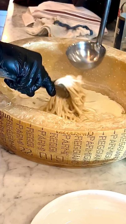 Ken Stewart's Tre Belle - Pasta in the making in the parm wheel - Italian Near Me - Bath, Ohio