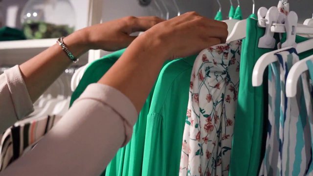Looking through a clothing rack