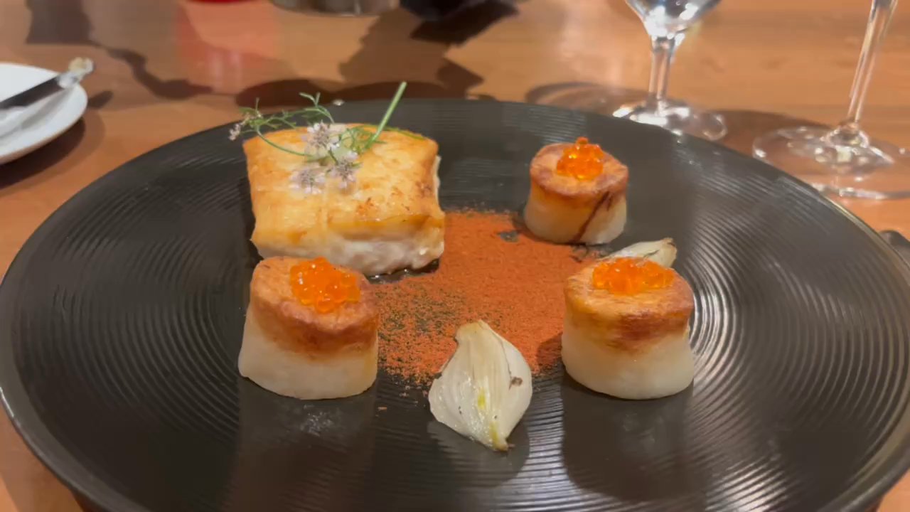 Restaurant R'evolution - Seared halibut and butter blanc with roasted potatoes and tomato dust - Cajun/Creole Near Me - New Orleans, Louisiana