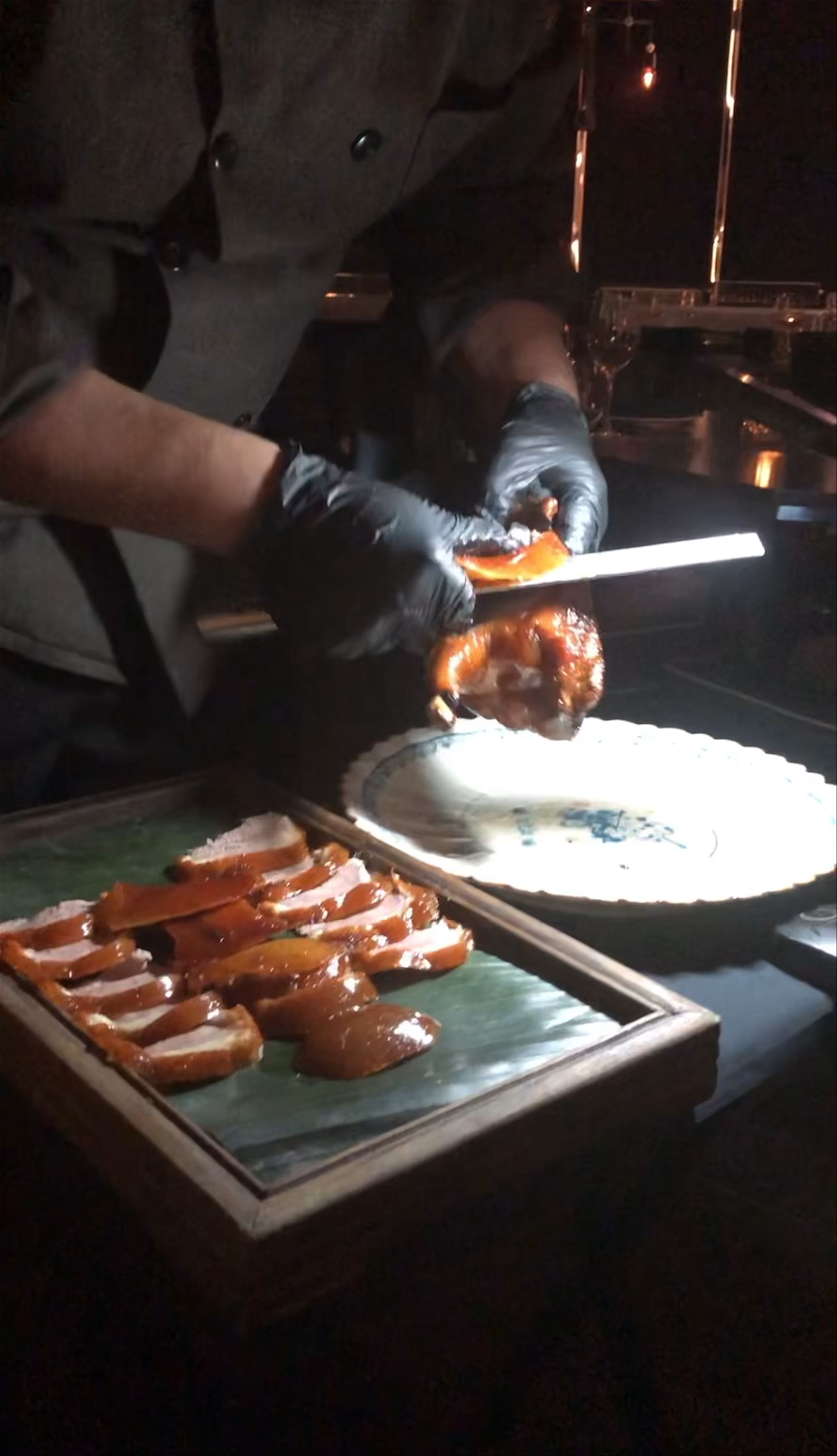 Crafting Perfection: Roast Duck Slicing at Hutong New York