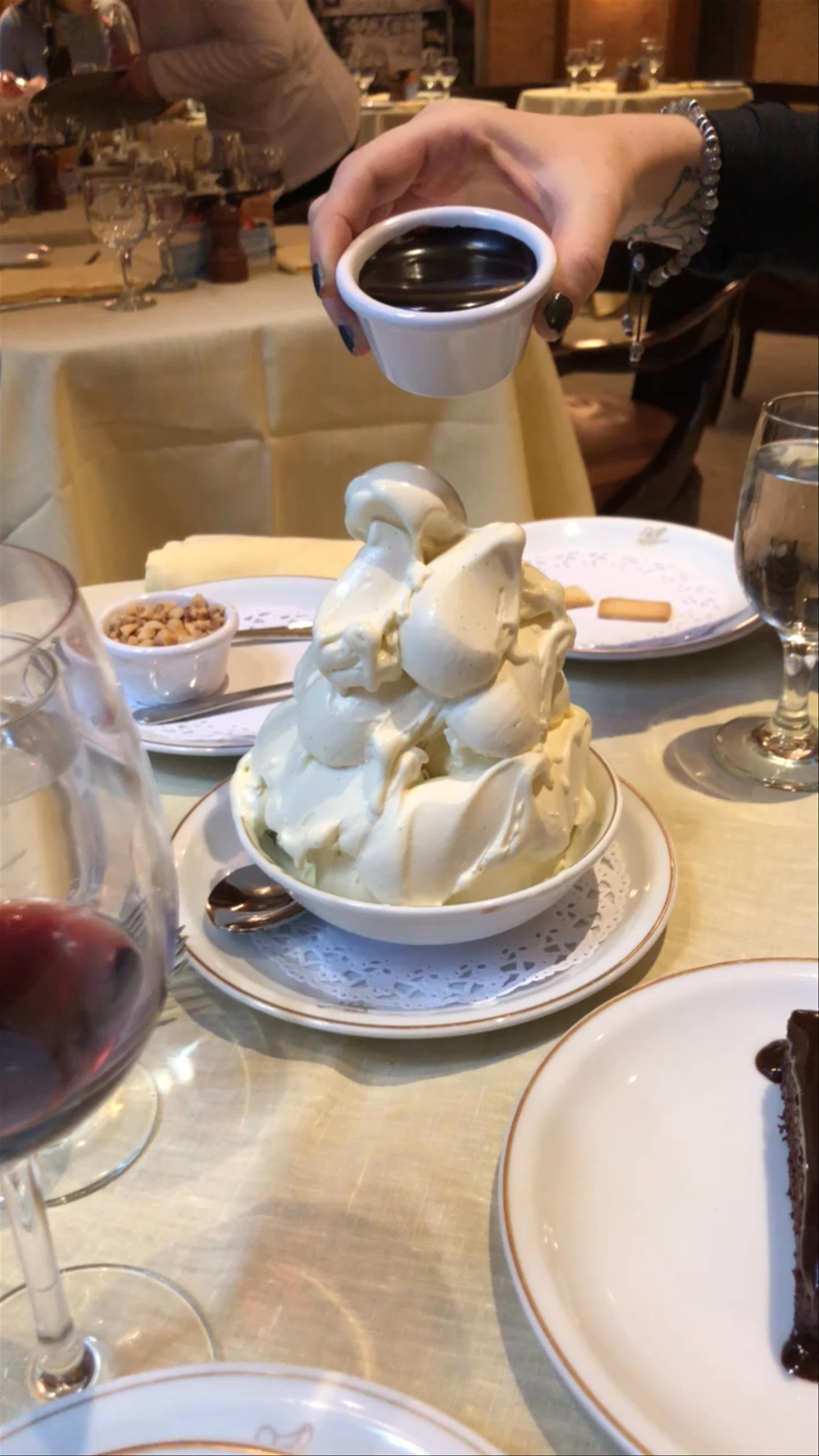 Decadent Chocolate Sauce Drizzled on Luxurious Italian Meringue Dessert at Cipriani Wall Street