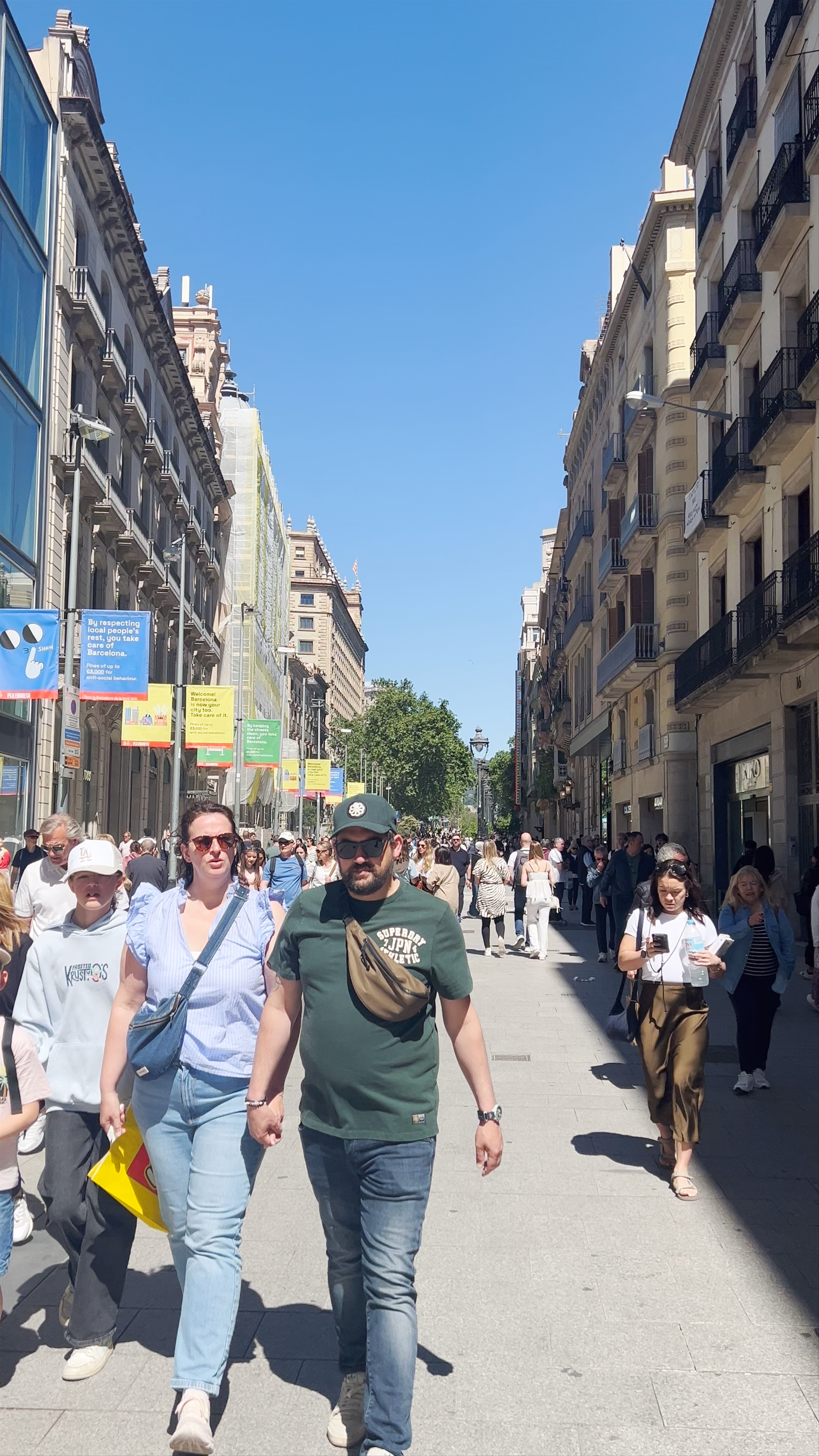 Vibrant Midday Stroll at Plaça de Catalunya, Barcelona