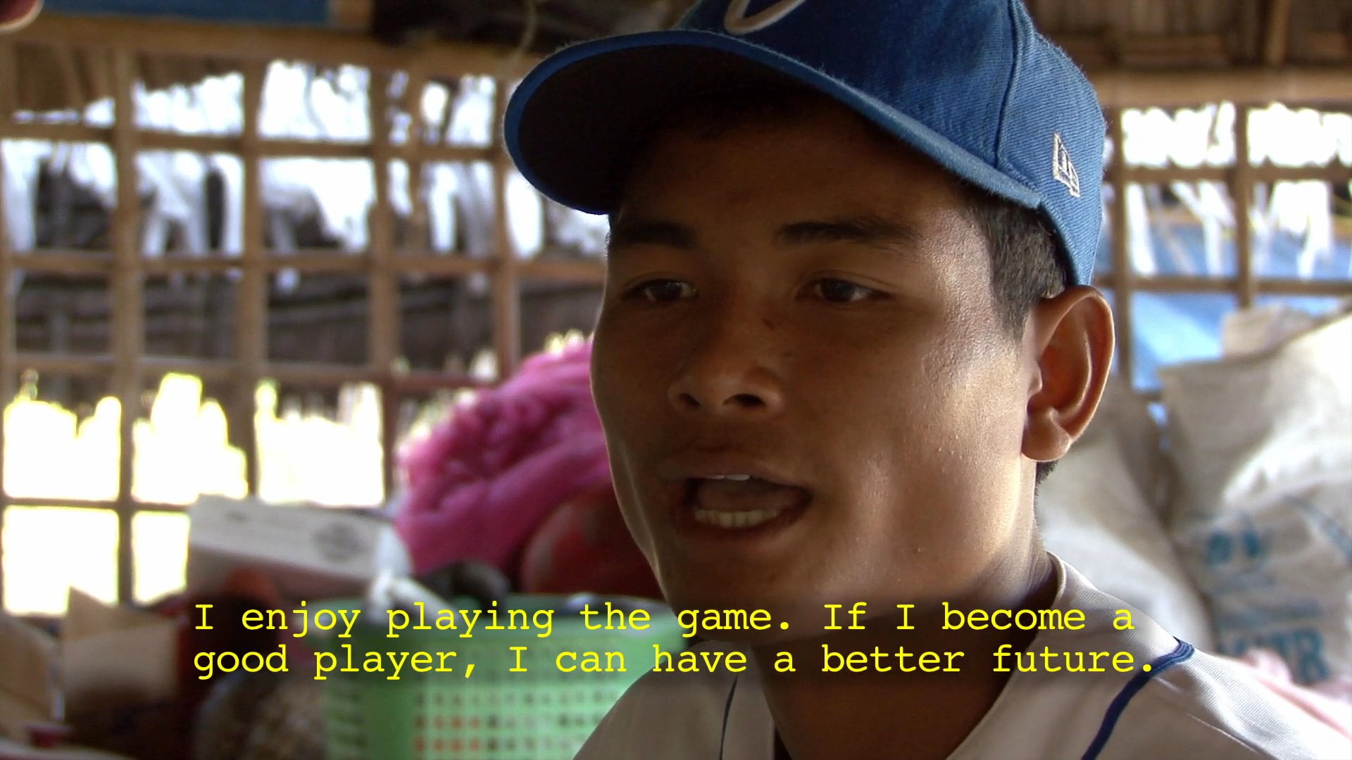 A young Cambodian baseball player shares his enthusiasm for the sport and his aspirations for a successful future through athletic development.