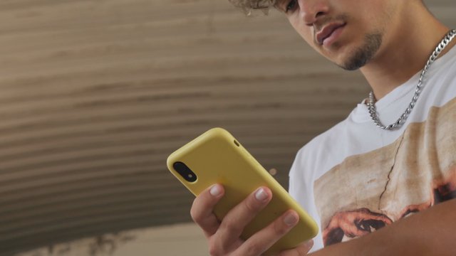 Man with a yellow iPhone