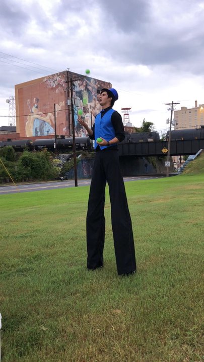 the Agora Borealis - 9/21/18 Friday. 5th Annual Cirque du Lake Street Festival in front of The Agora Borealis. Stilt Man's got mad skillz! Juggling for the kids! - Art Galleries Near Me - Shreveport, Louisiana