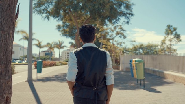 A man strolling around the city and taking in the scenery