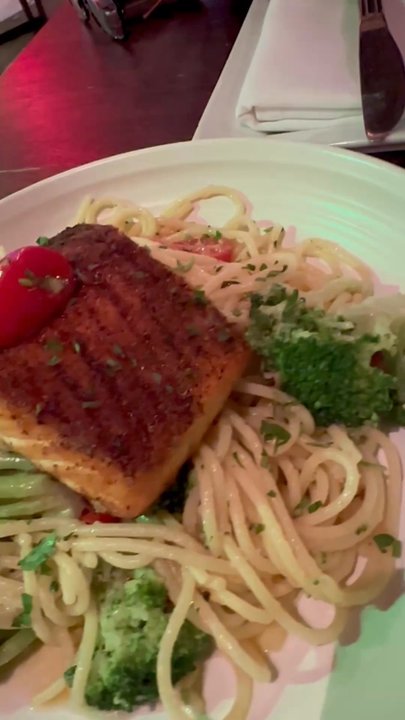 Fiorella's Italian Kitchen - Salmon, tomatoes, and broccoli over garlic pasta prepared in olive oil - Pizza Near Me - Oxon Hill, Maryland