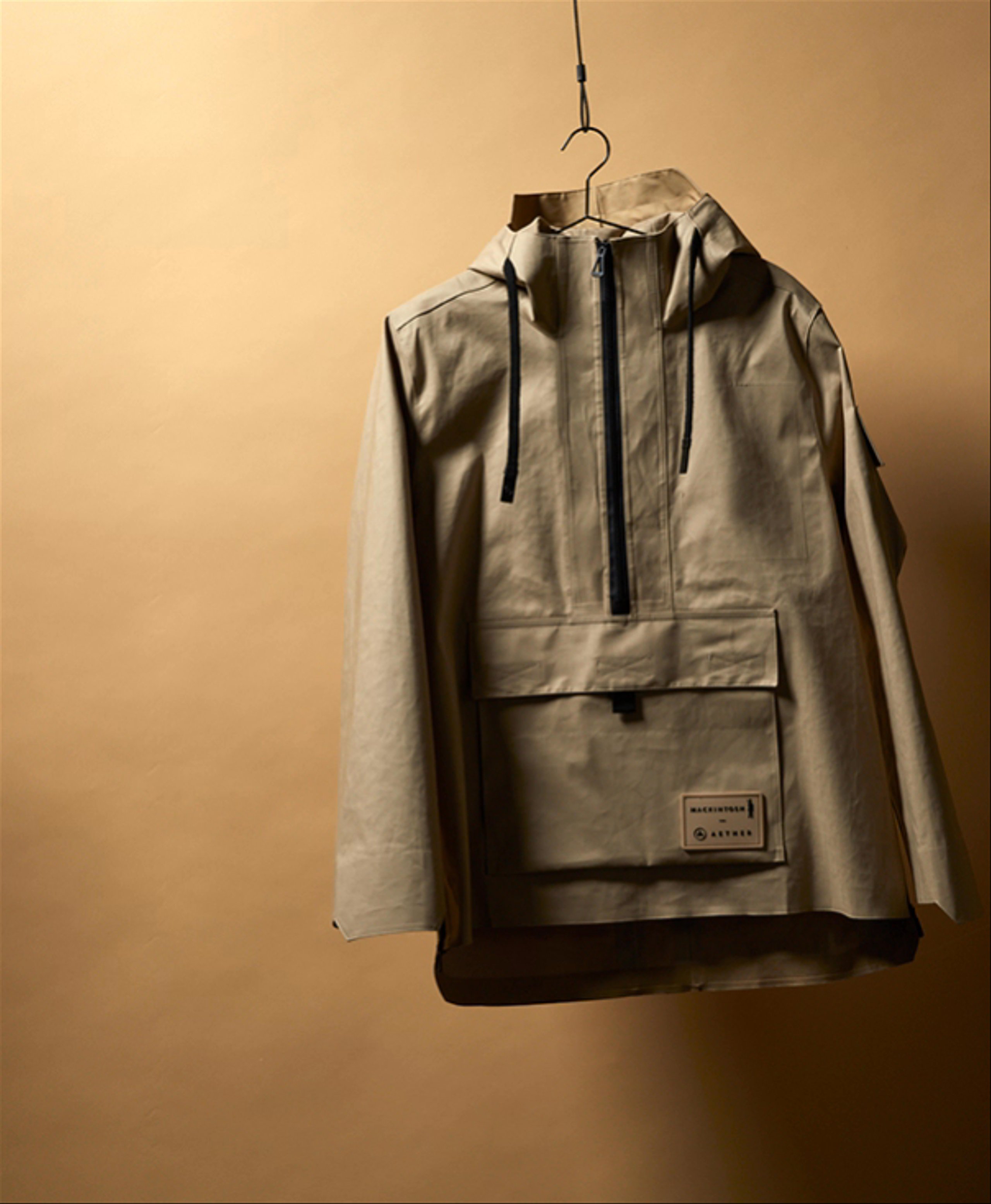 Stop-motion video of AETHER + Mackintosh Field Anorak hanging from cord 