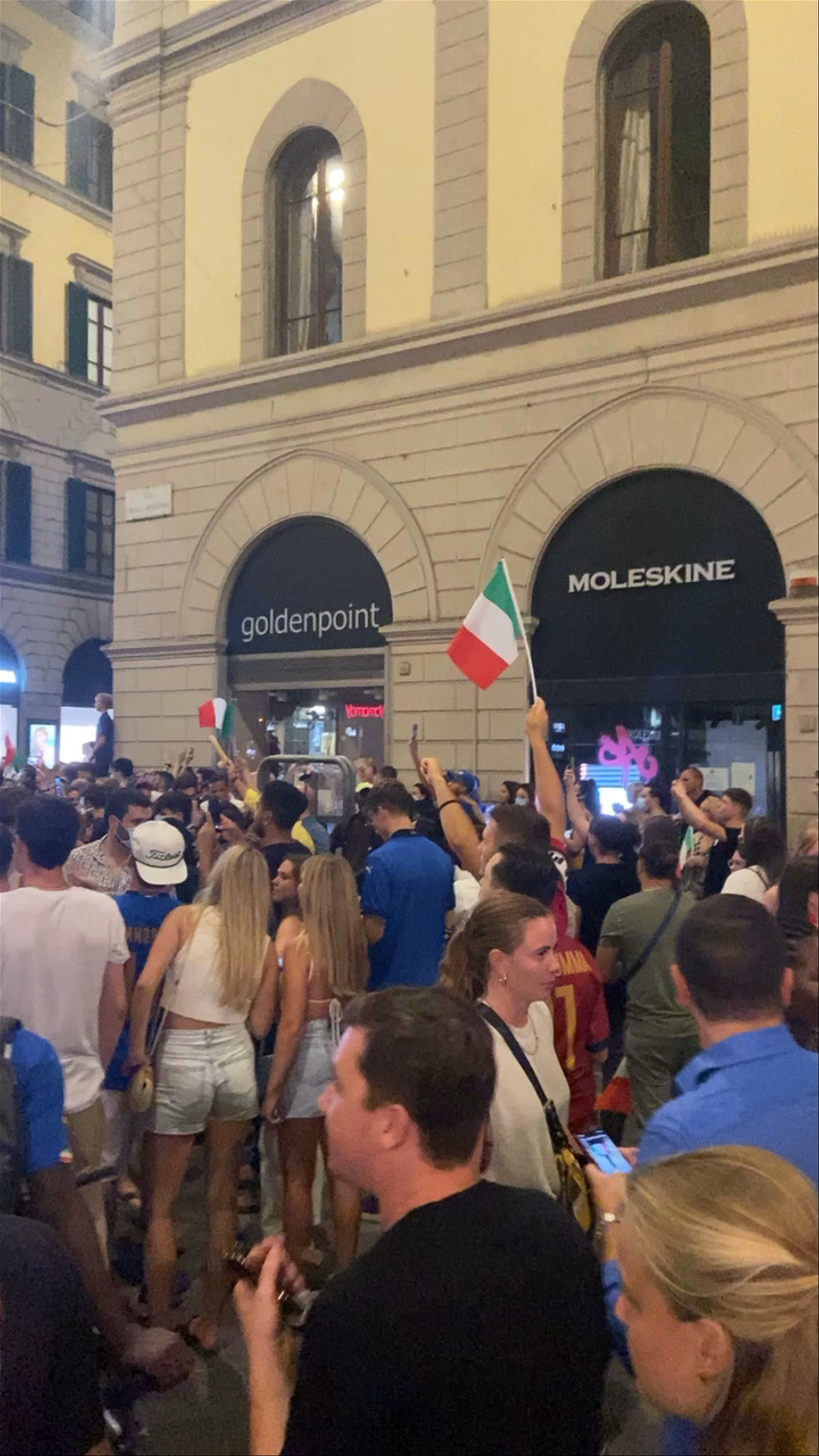 Nighttime Street Celebration in Florence Amidst Historic Architecture