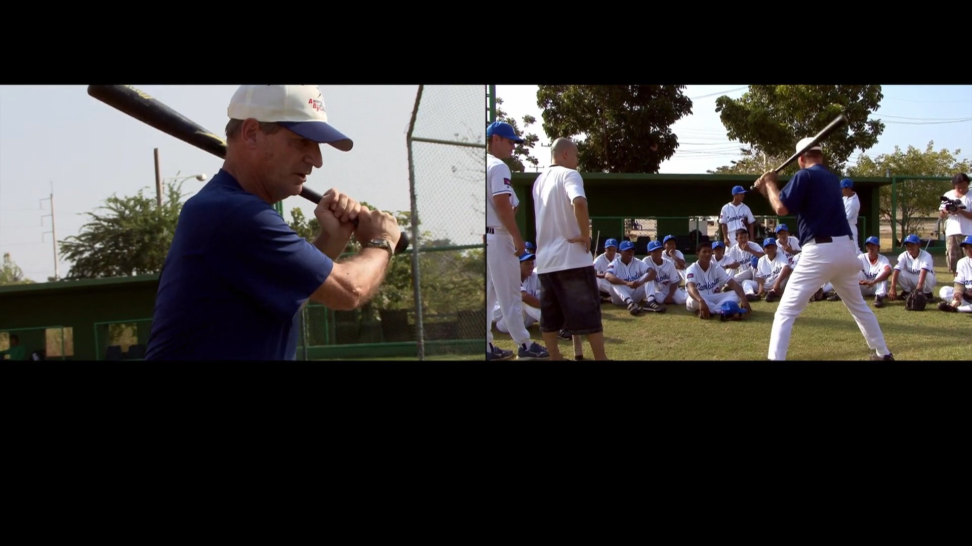 A coach provides batting technique instruction to youth baseball players during an outdoor team training session.
