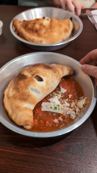 Del Vecchios - Spinning Calzone just because - Italian Near Me - Asheville, North Carolina