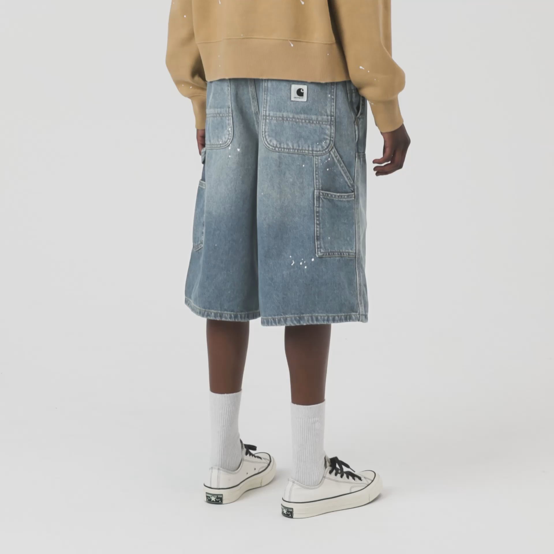 Model wearing a pair of W Nixon Double Knee Shorts
