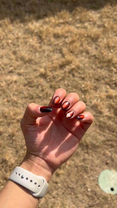 SA Nails Spa 1 - Black polish base with red cat eye polis on top and a light pink heart w gold outline on the ring finger - Nail Salons Near Me - San Antonio, Texas