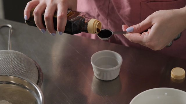 Pouring syrup into a bowl