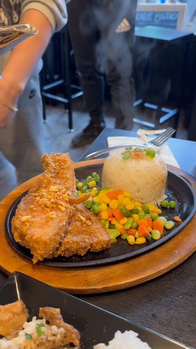 Kalye Bistro - The pork chops someone at my table ordered - good sauce  Big portion though - Filipino Near Me - Woodside, New York