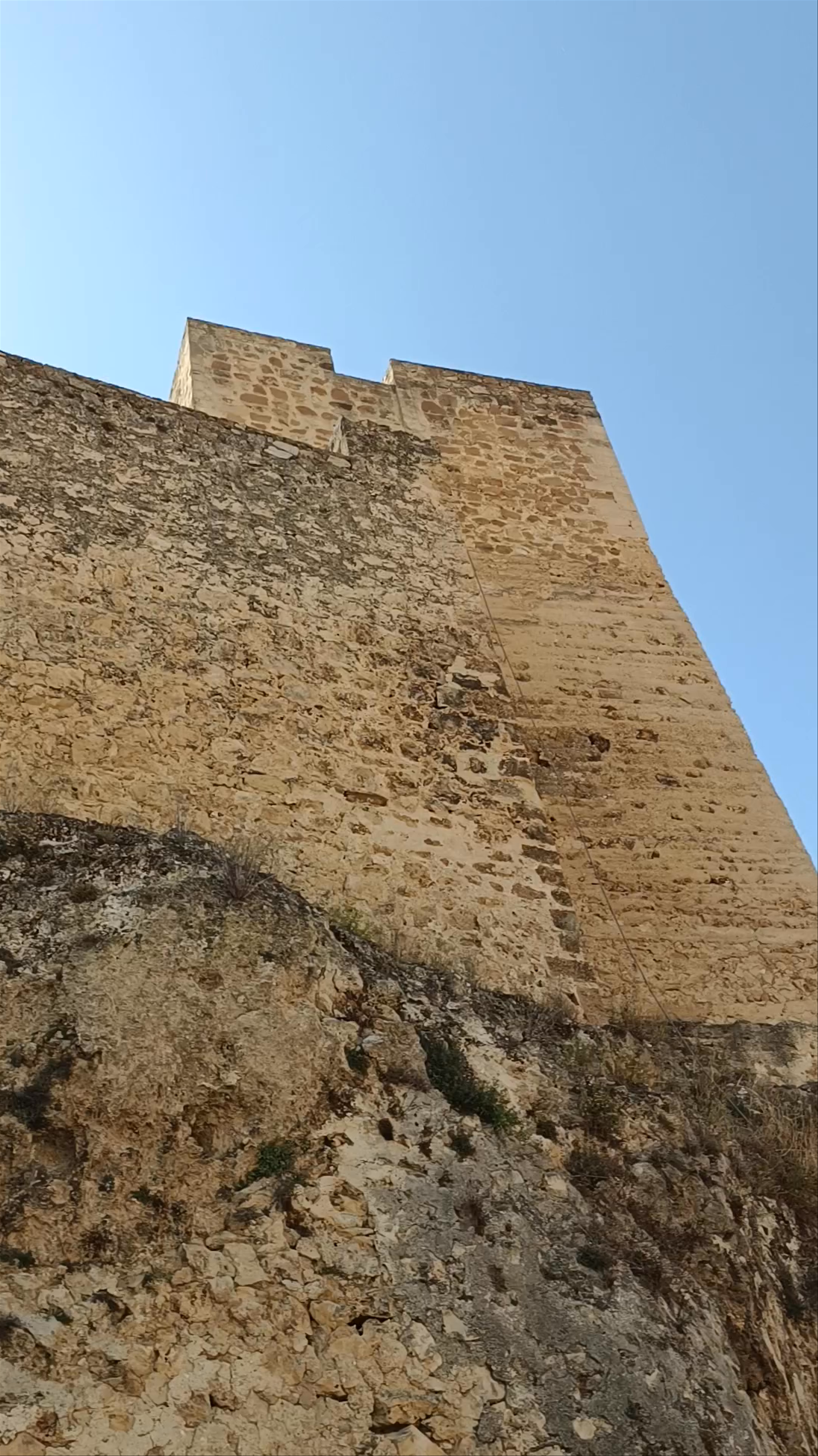 Castillo de Yeste: A Majestic Spanish Fortress Under Clear Blue Skies