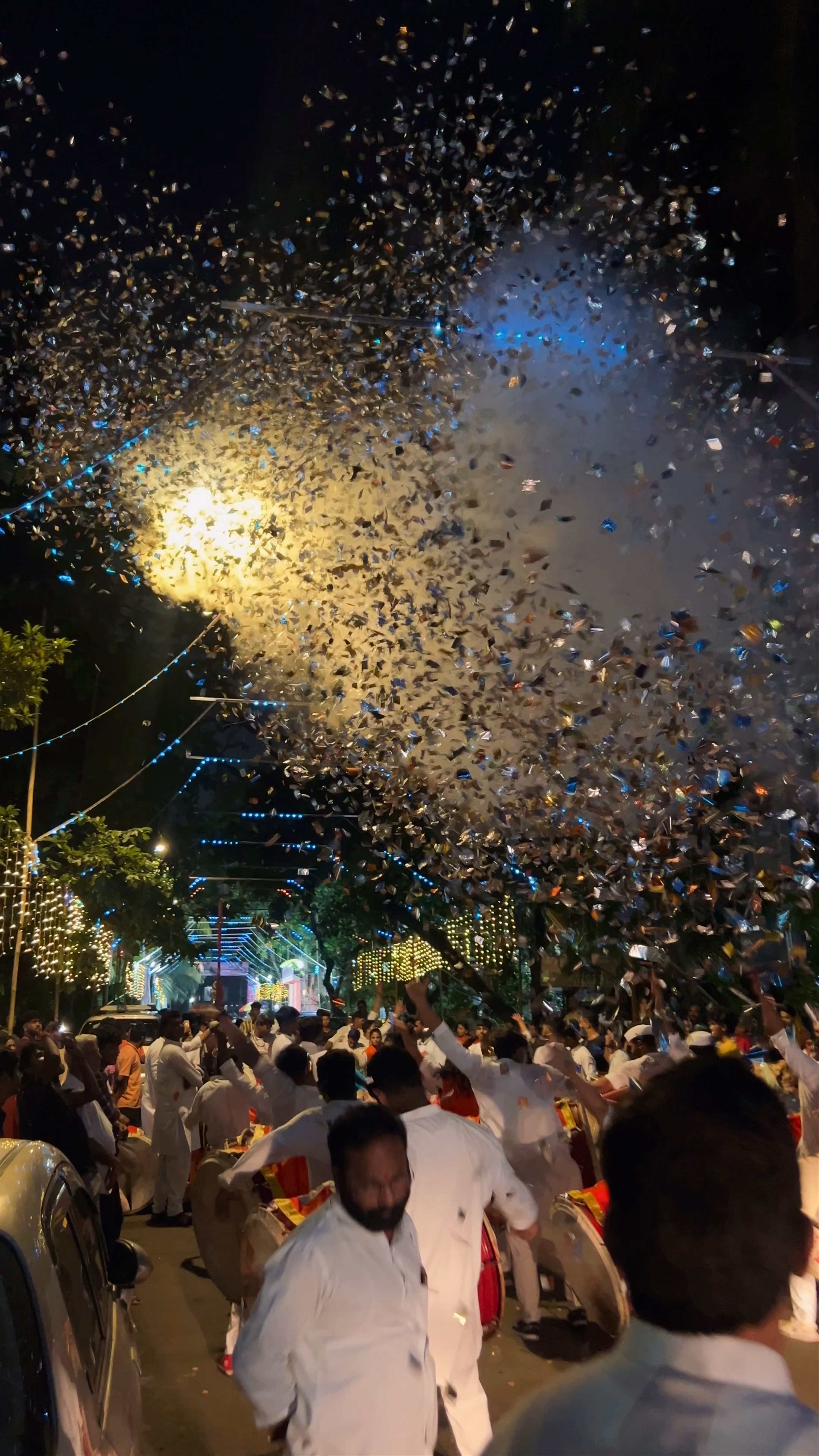 Vibrant Night Celebration with Drums and Confetti in Mumbai