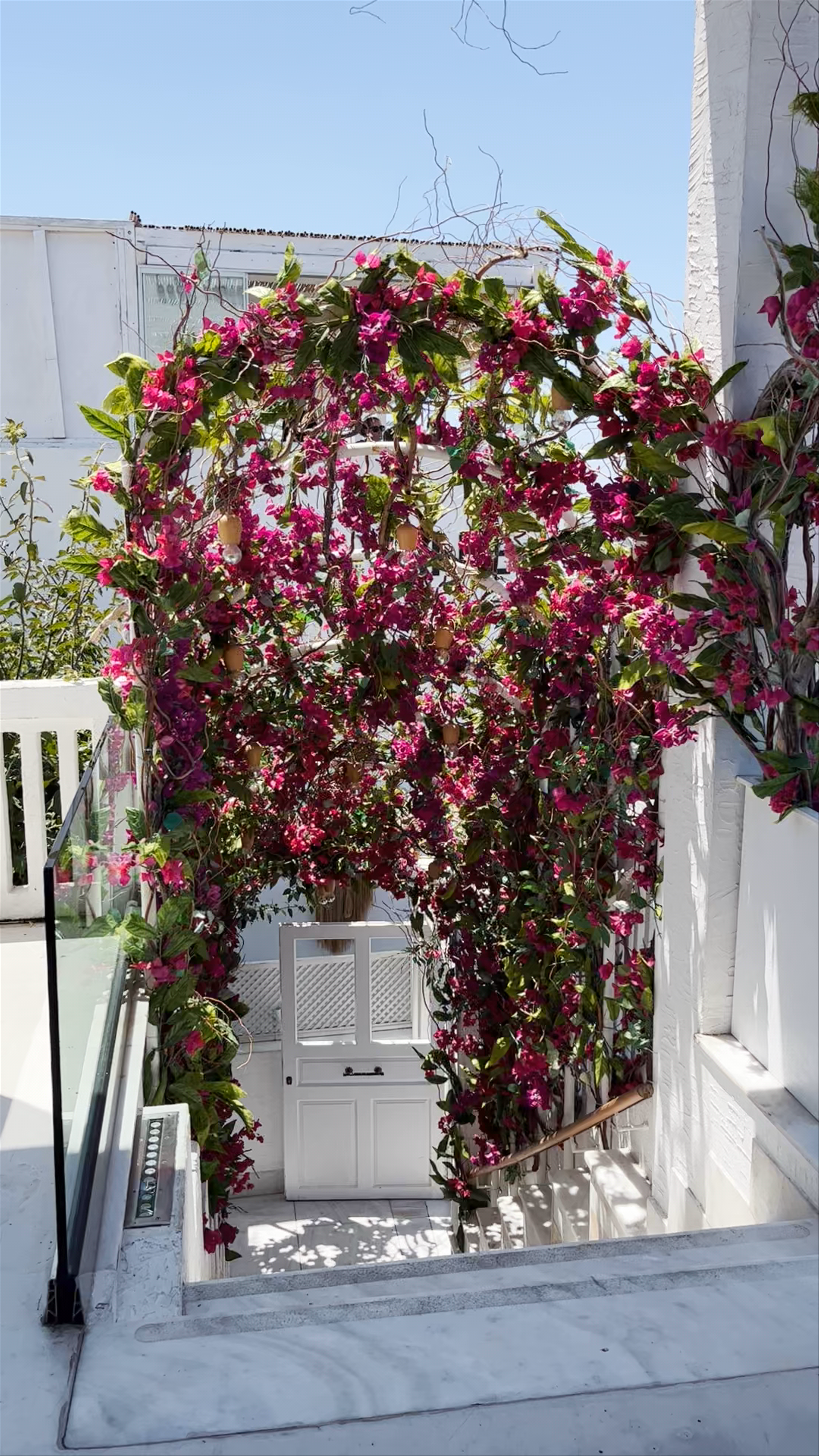 Santorini's Serene Floral Stairway and Stunning Caldera Views at Kaliya Reimagined