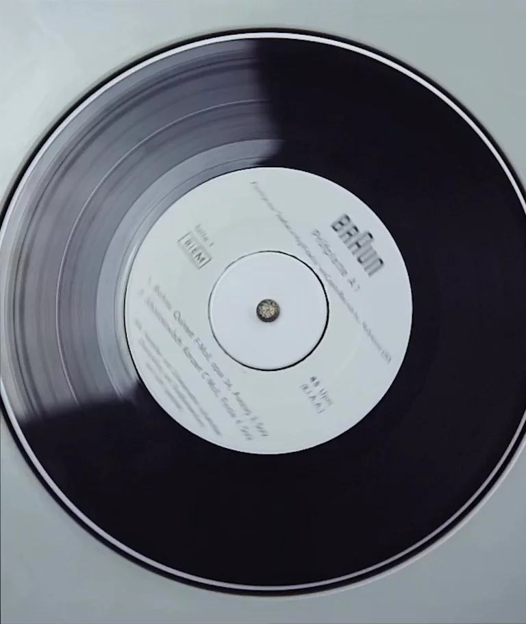 Top view video of hand placing needle of record