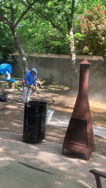 Bryant Lawn and Sprinkler - Using the weed trimmer to get of the killed grass/weeds for a clean slate - Landscaping Near Me - Fort Worth, Texas