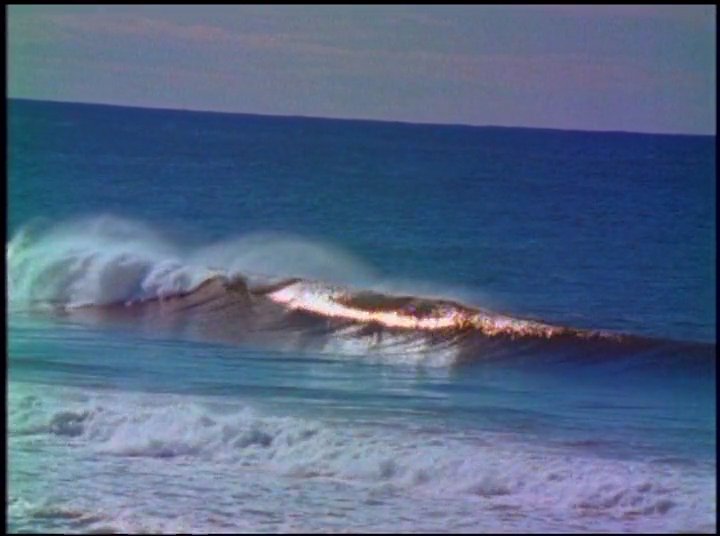 Eve Fletcher shares personal insights during a sit-down interview, interspersed with cinematic footage of ocean waves at sunset.
