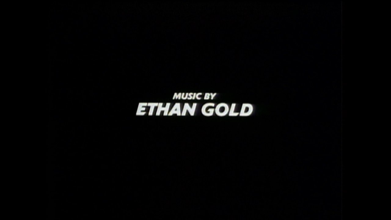 Text overlays display the production team members against a minimalist black background, interspersed with brief glimpses of stylized abstract visuals and a person poolside.