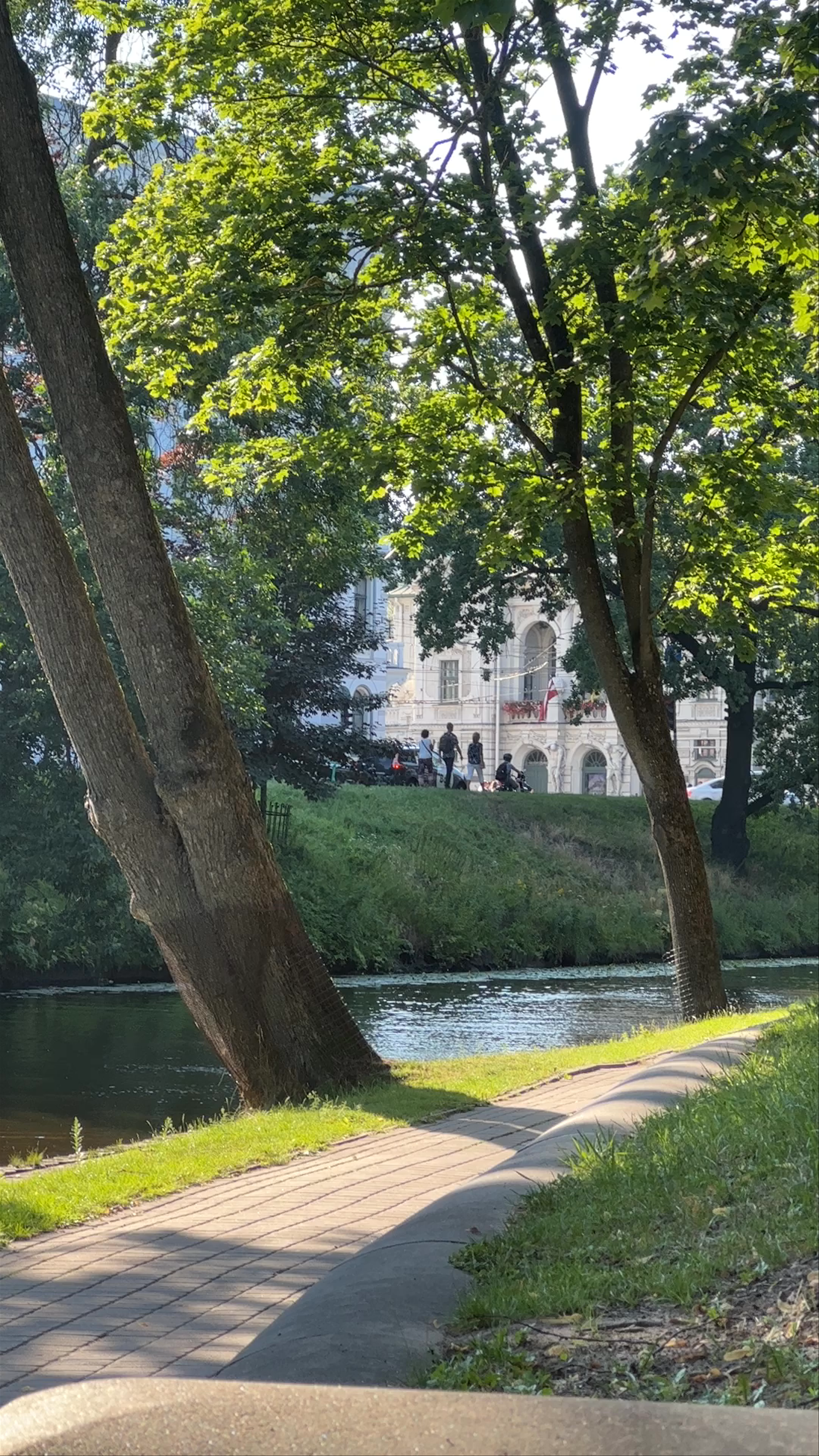 Serene Riverside Walk at Bastejkalns Park, Riga