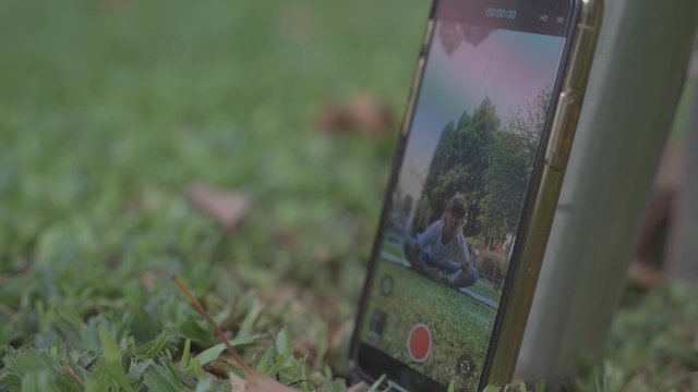 Smartphone camera recording a yoga practice