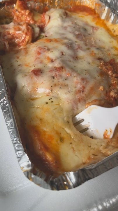 Cafe Manhattan - Cheese pull from the lasagna - Pizza Near Me - Saint Louis, Missouri