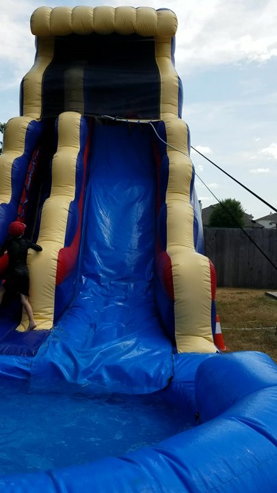 Operation Jump - Still going strong with more kids from the neighborhood that can't get enough of this 20 ft water slide. Too much fun! - Party Supplies Near Me - Leander, Texas
