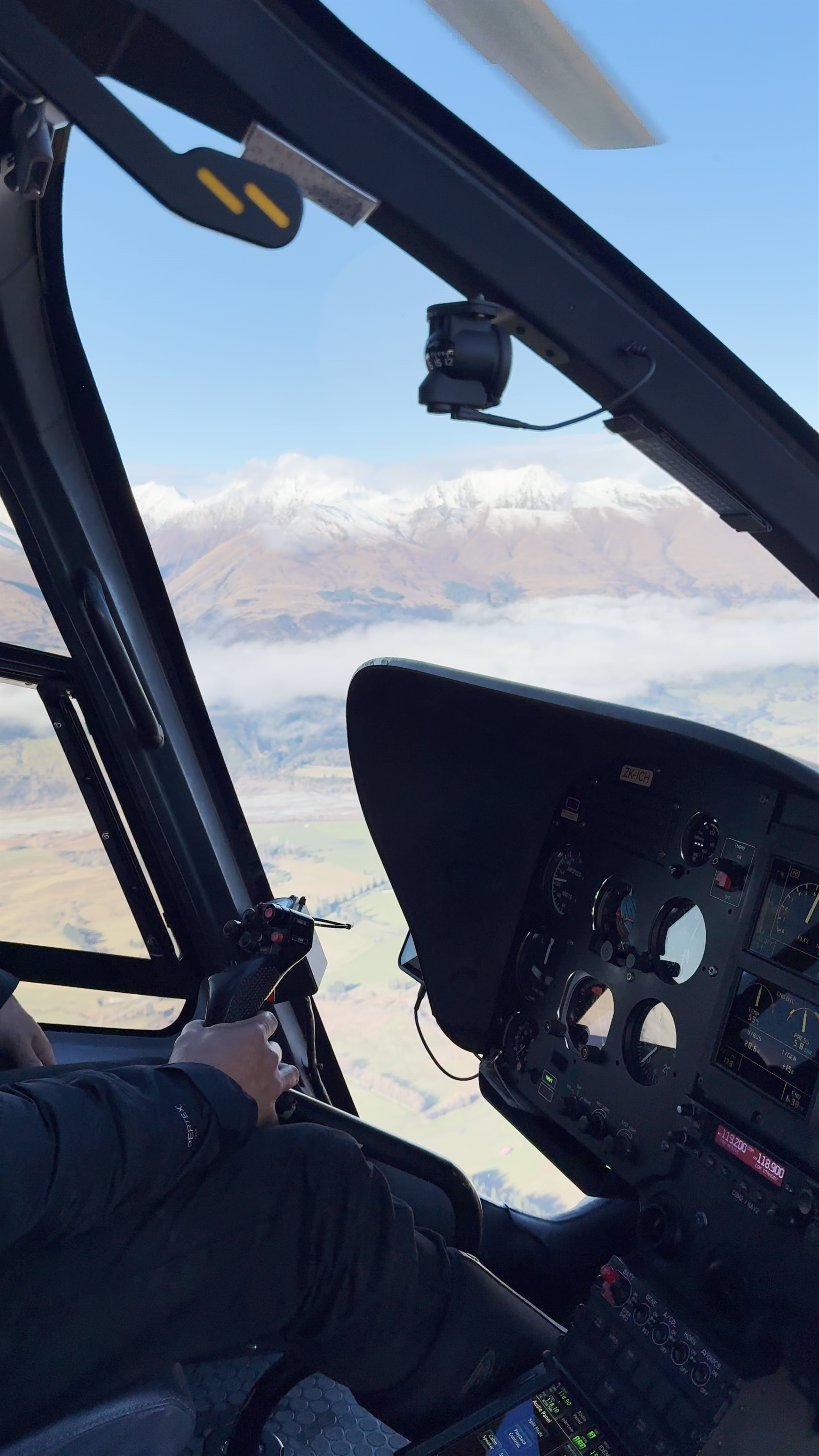 Helicopter Flight Over Snow-Capped Mountains in Queenstown, New Zealand