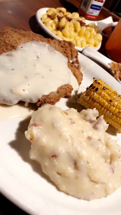 Cool Hand Luke's - I got a chicken fried steak, mashed potatoes, corn on the cob ($24.99) which was really good.  Along with a side of Bacon, Mac & Cheese $6 - Steakhouses Near Me - Tulare, California