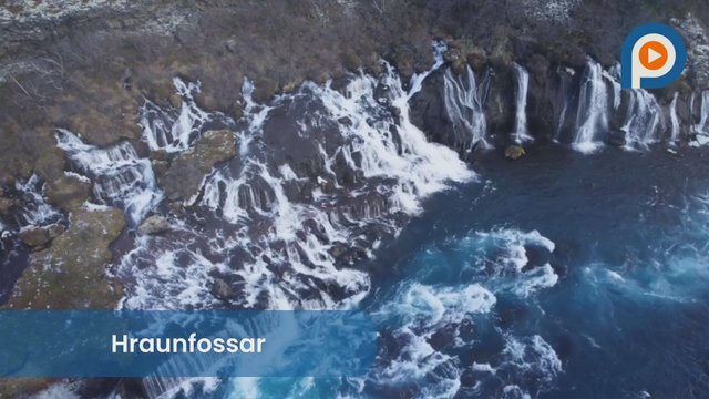 Hraunfossar: A wide series of waterfalls emerging from a volcanic lava field in West Iceland