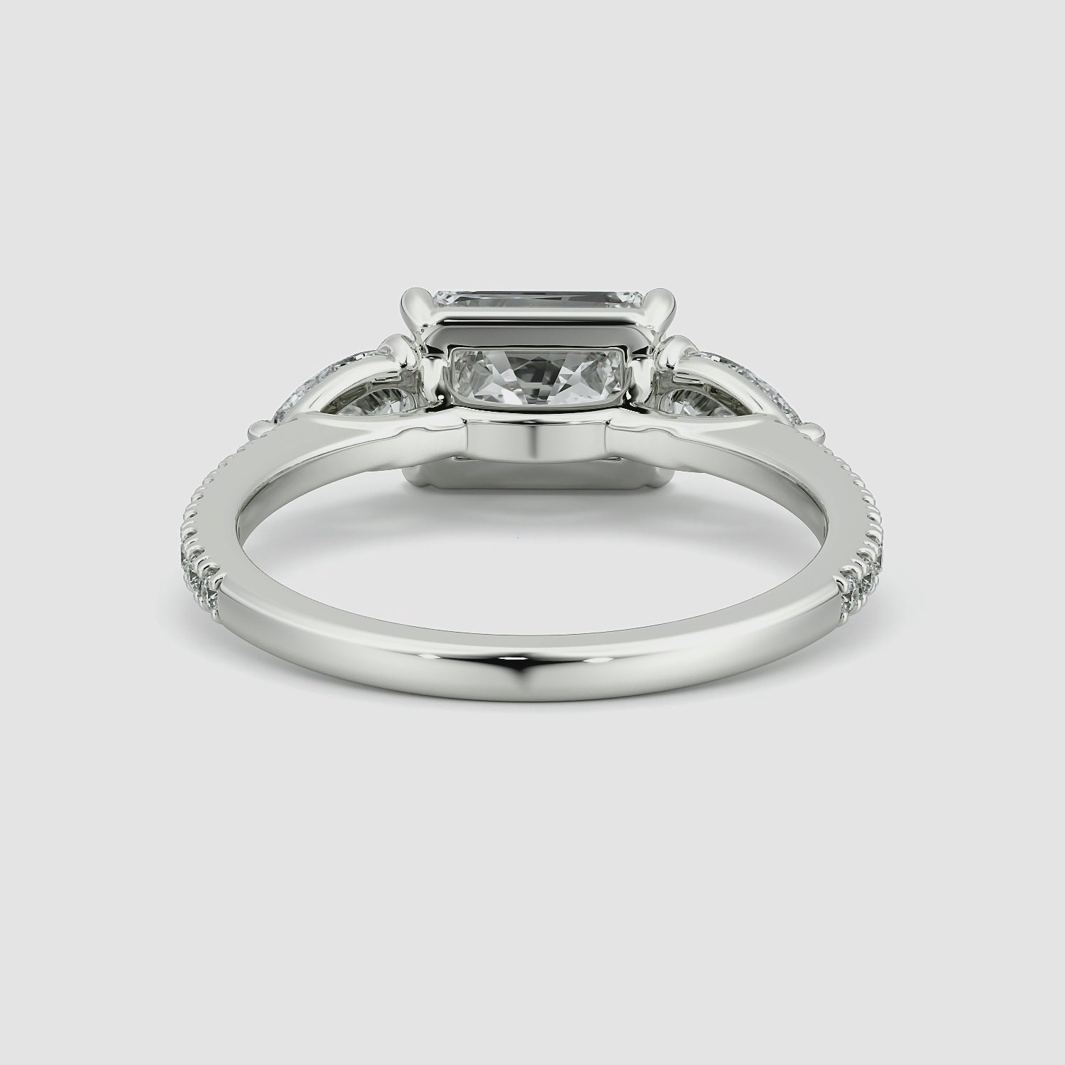 The Three Stone | Radiant | Platinum | bandAccent: Pavé | diamondOrientation: horizontal | sideStoneCarat: 0.25ct | sideStoneShape: Pear | caratWeight: other