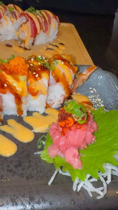 Taiko Sushi - Scorpion roll (black plate) and Red Dragon roll (bamboo plate) - Sushi Bars Near Me - Folsom, California