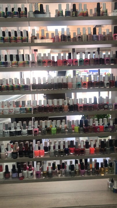 Sona Nails & Spa - Super clean, lots of nail polish options. There's a small bench on the other side of that wall of nail polish to wait at. - Waxing Near Me - Forest Hills, New York