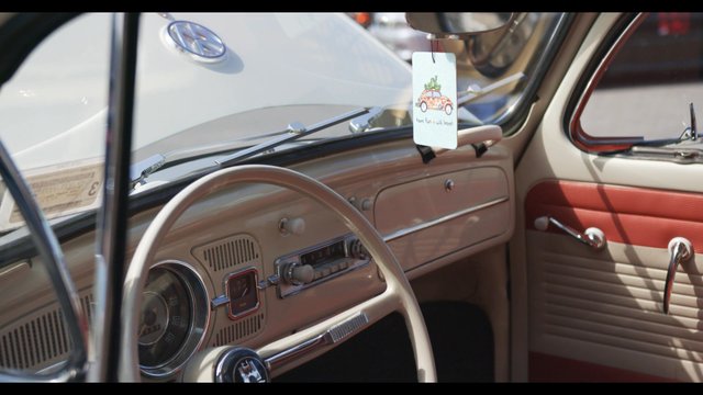 View inside vintage Volkswagen Bug through the driver’s window